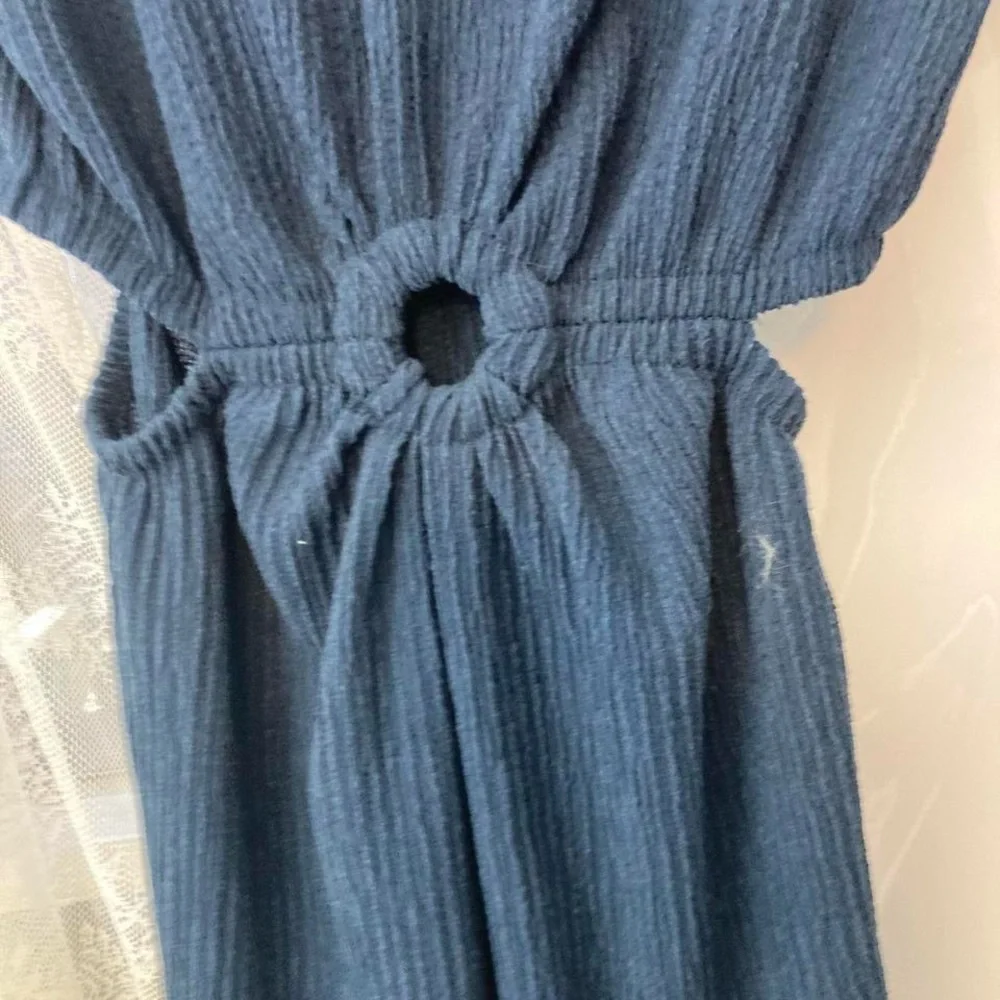Navy blue jumpsuit with keyhole middle and open sides back slit as well girls 9